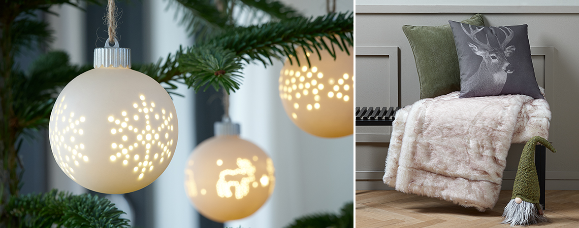Biele vianočné gule s LED na vianočnom stromčeku a škriatok pri lavici s vankúšmi a dekami