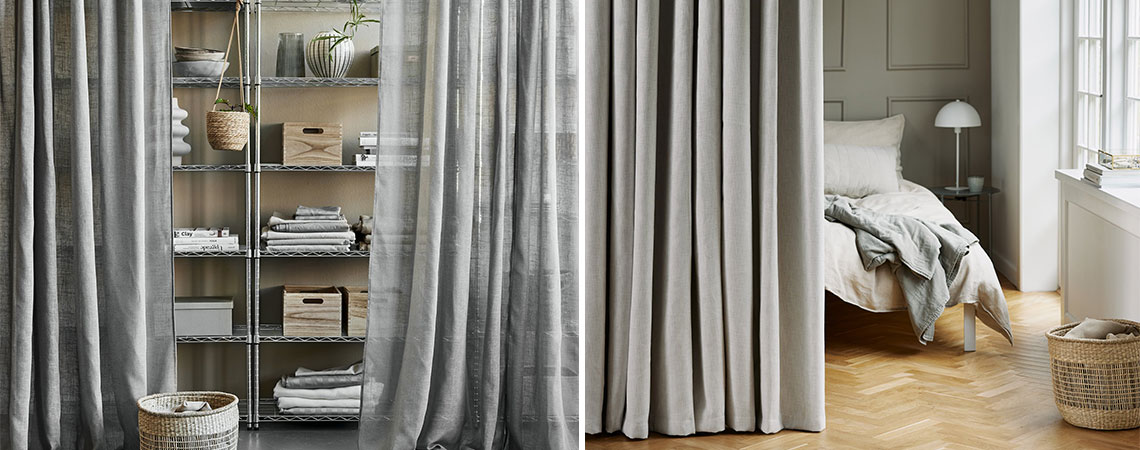 Sheer curtain in front of shelving unit and beige curtain in front of bed