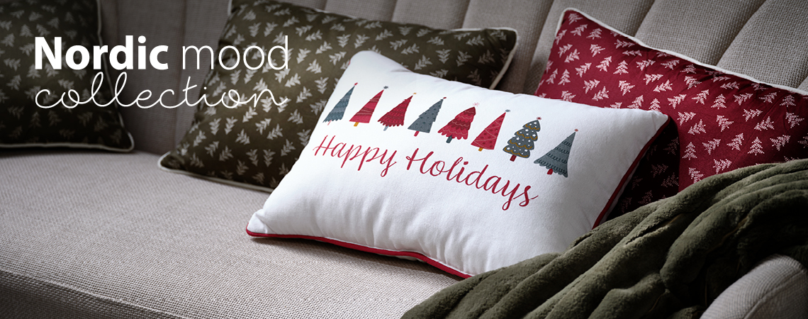 Vianočné dekorácie v škandinávskom dizajne ako napríklad ozdobné vankúše a deky