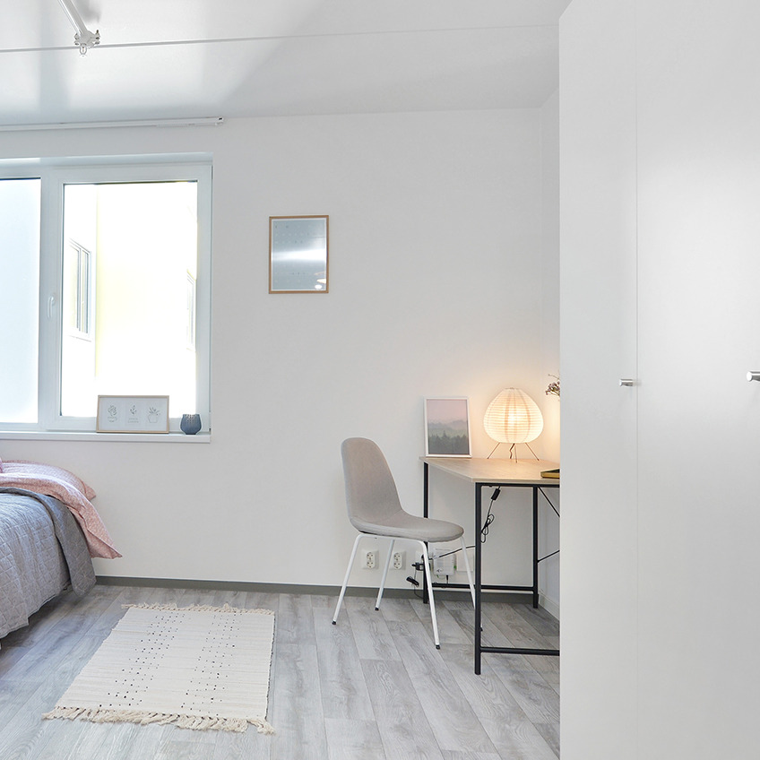 VANDBORG desk Furnished bedroom with desk, chair, and decoration