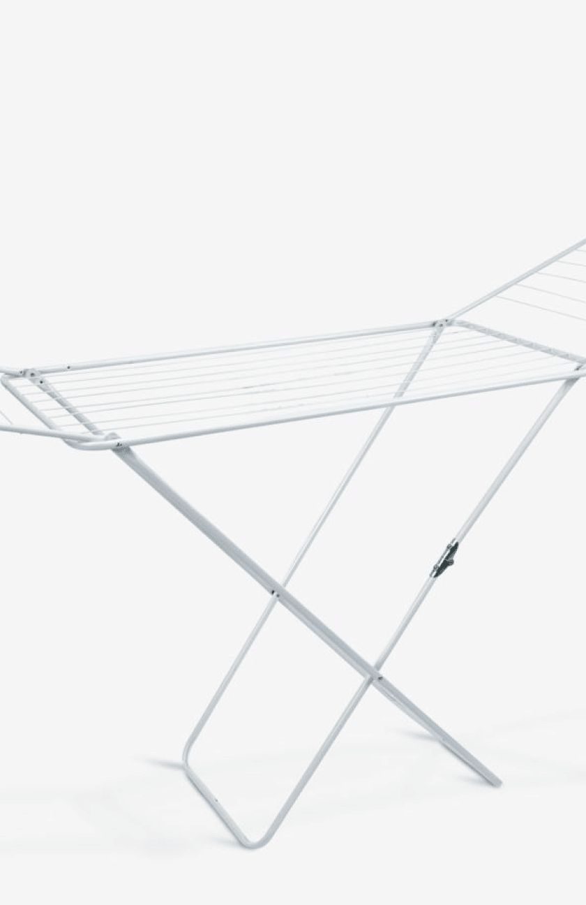 White foldable X-frame clothes airer with multiple drying bars, shown against a plain white background.