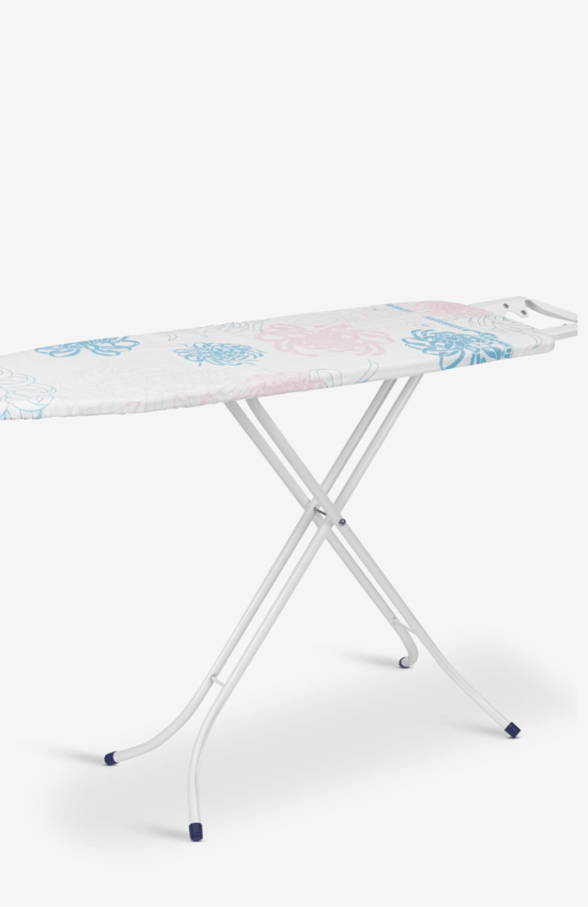 White ironing board with a folding leg stand and a pink and blue floral-patterned cover, shown against a plain white background.