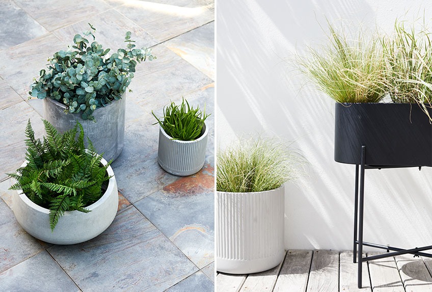 Large garden pots and tall planter on a patio 