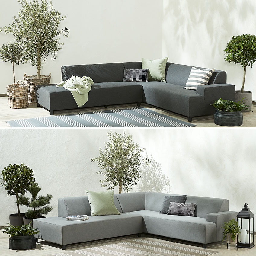 UHRE lounge sofa is available in dark grey and light grey Dark and light grey garden sofa on in a corner on a patio