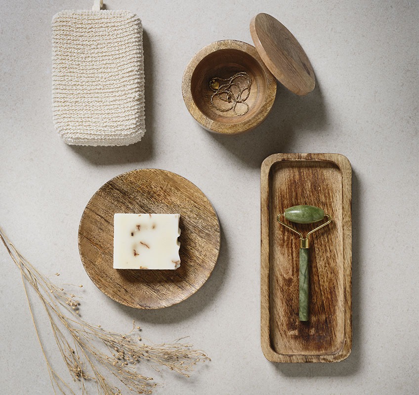 Wooden trays and jar with face roller and soap 