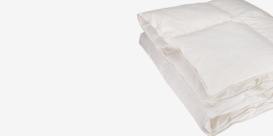 Folded white duvet with a quilted box pattern, shown against a plain light grey background.