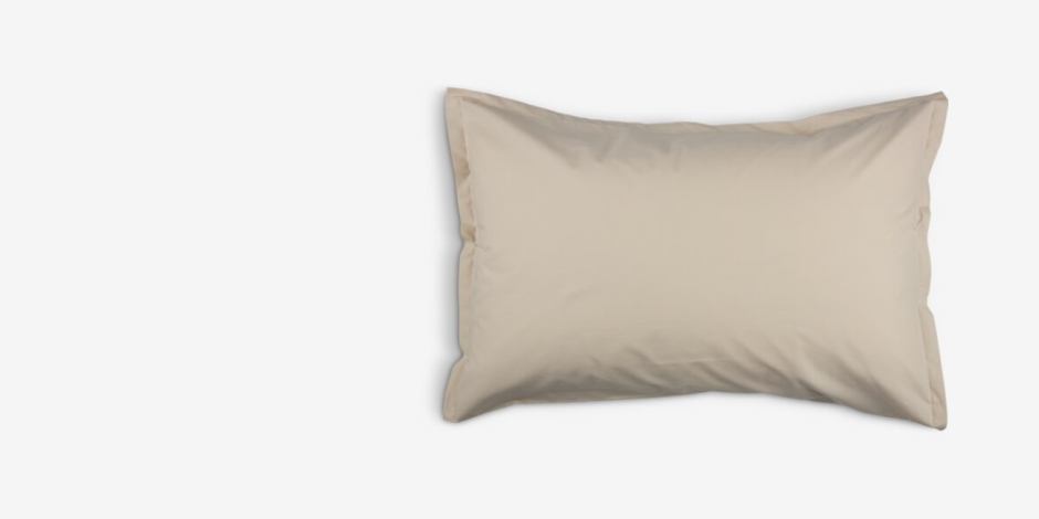 Beige cotton pillowcase with a flanged edge, shown against a plain light grey background.