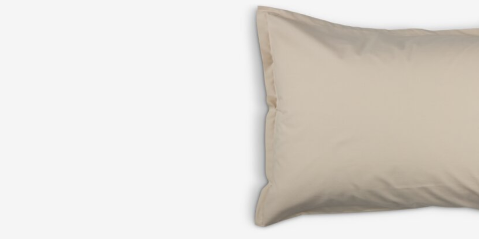 Beige cotton pillowcase with a flanged edge, shown against a plain light grey background.